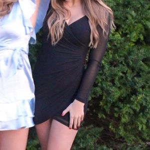 Ruched black bodycon dress with tulip bottom hem